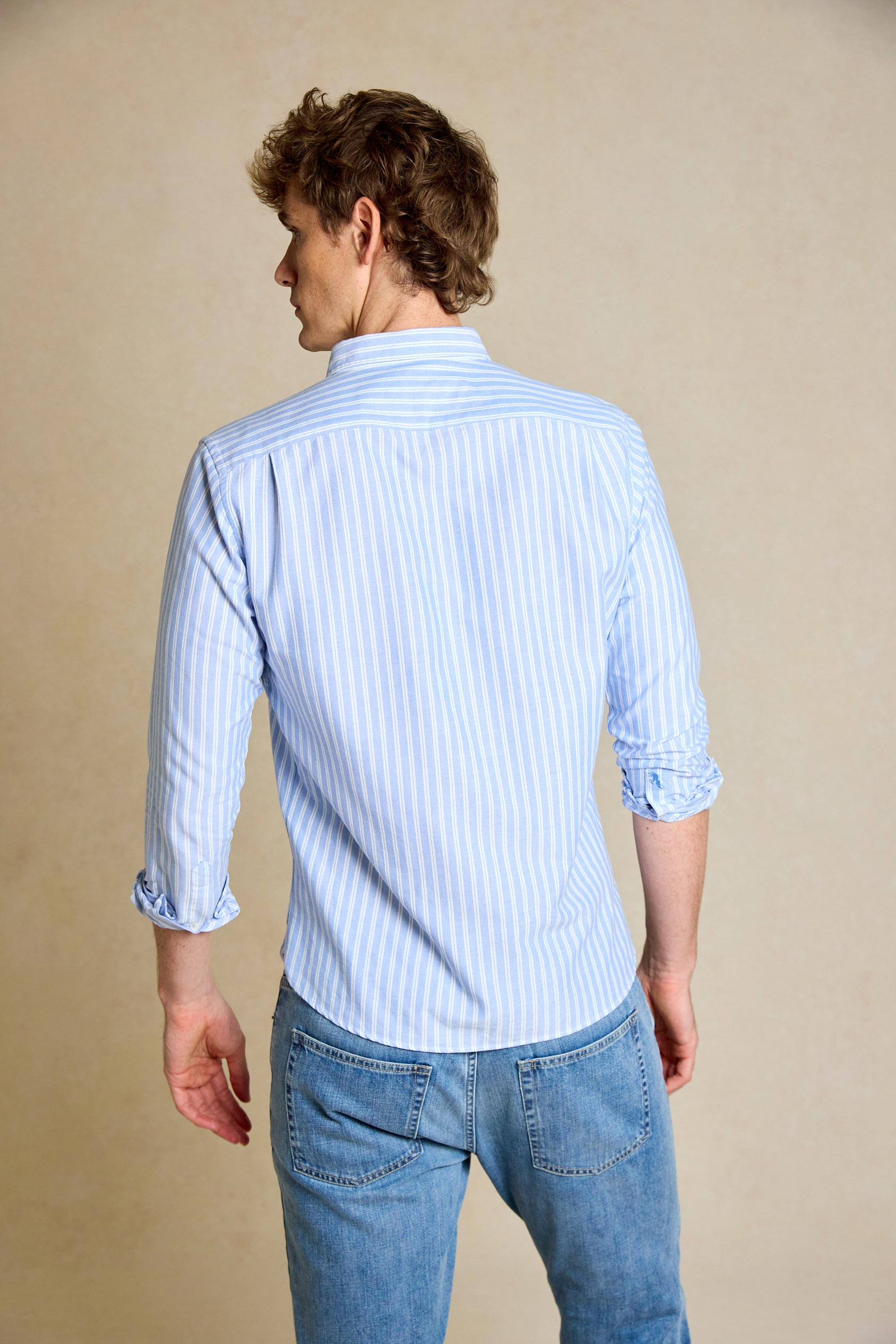 Elevate your look with the Avoch Sky Stripe Oxford Shirt. This versatile shirt combines classic stripes with a modern fit, perfect for any occasion.