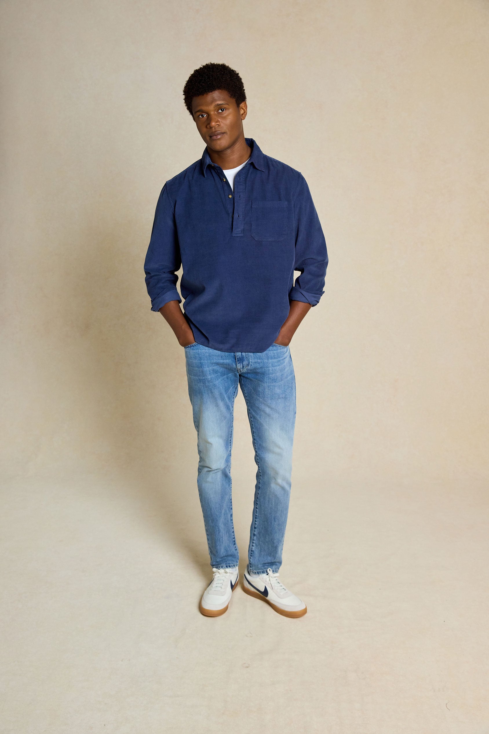 Elevate your look with the Bedgebury Navy Cord Popover Shirt. Garment-dyed for unique fading, this shirt blends distinctive style with modern comfort.