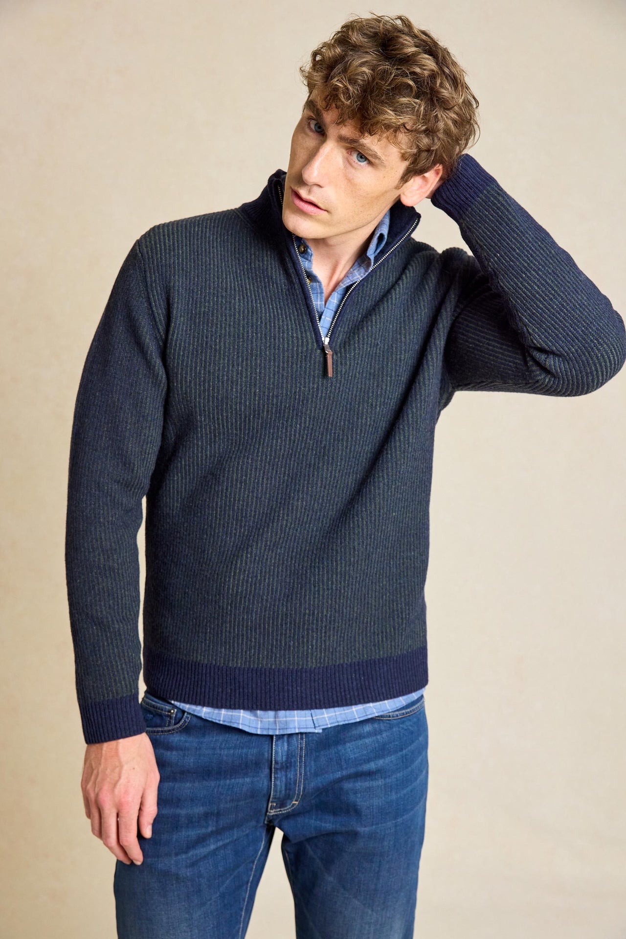 Elevate your wardrobe with the Bellever Navy Rib Half Zip Jumper. This versatile piece features a classic ribbed design and half zip neck for a stylish yet comfortable fit.