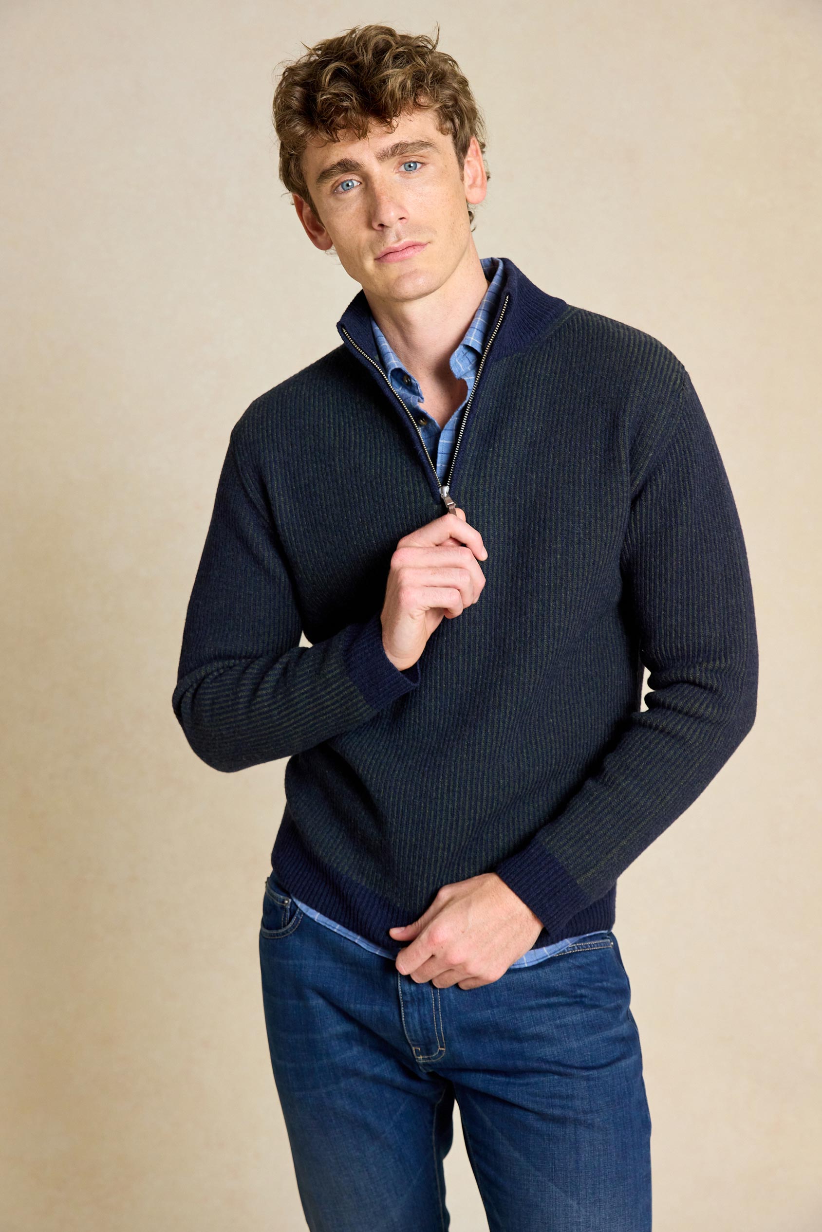 Elevate your wardrobe with the Bellever Navy Rib Half Zip Jumper. This versatile piece features a classic ribbed design and half zip neck for a stylish yet comfortable fit.