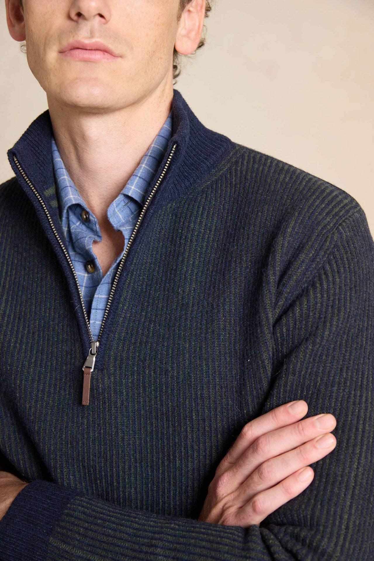 Elevate your wardrobe with the Bellever Navy Rib Half Zip Jumper. This versatile piece features a classic ribbed design and half zip neck for a stylish yet comfortable fit.