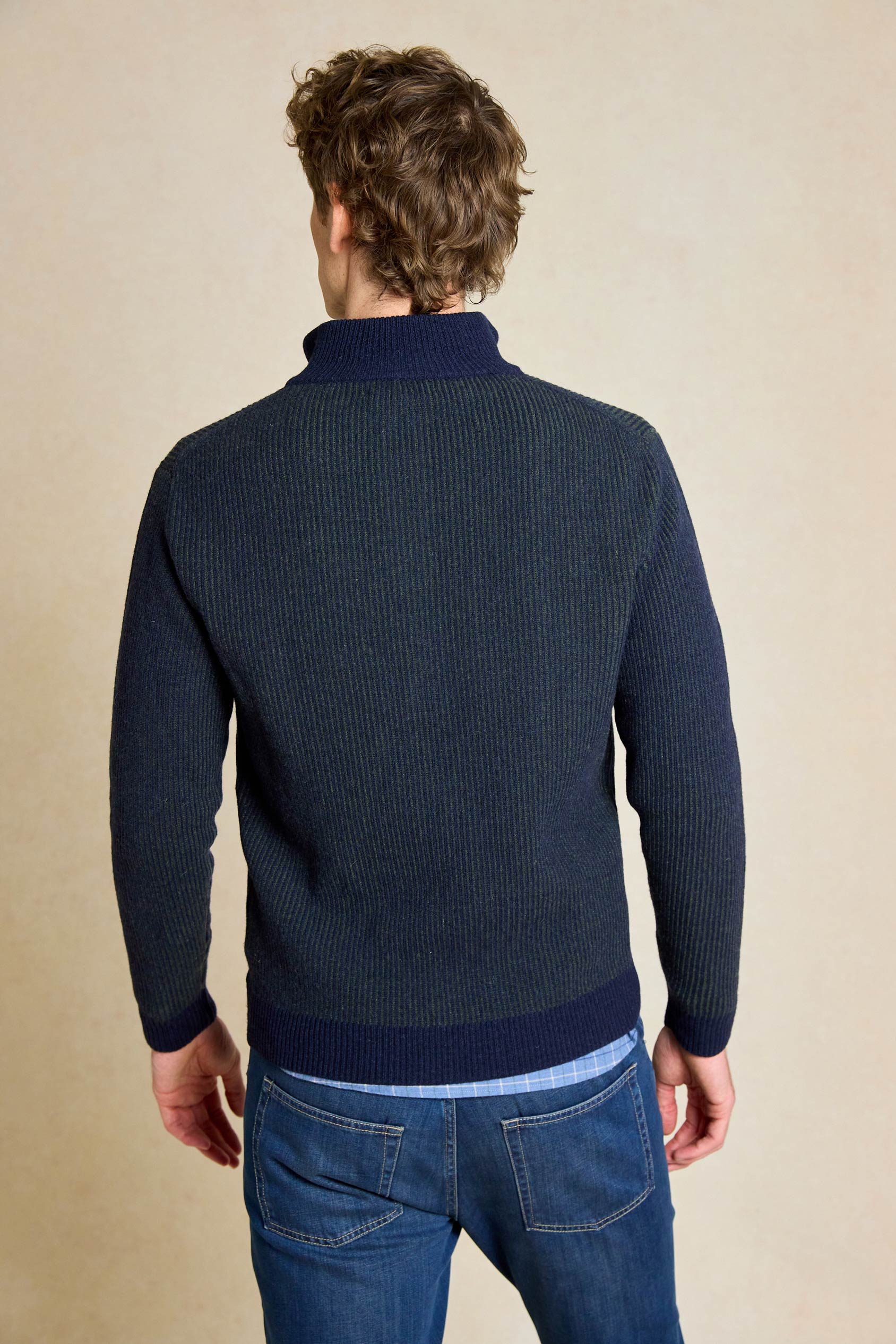 Elevate your wardrobe with the Bellever Navy Rib Half Zip Jumper. This versatile piece features a classic ribbed design and half zip neck for a stylish yet comfortable fit.