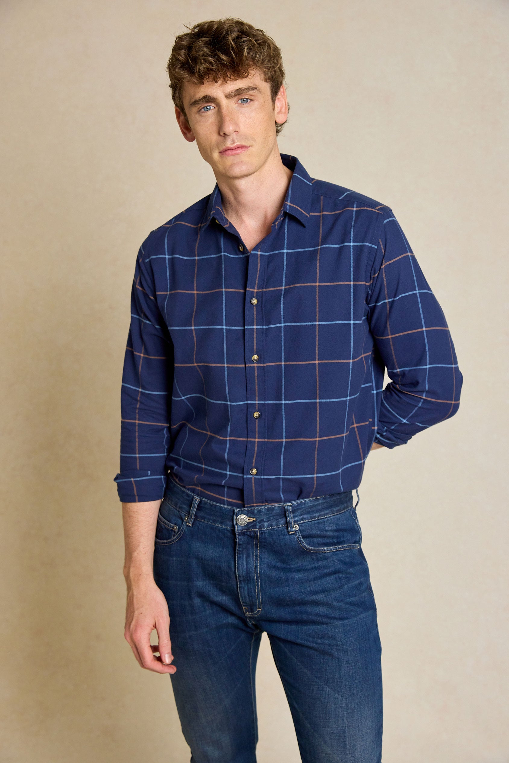 Refine your wardrobe with the Burnham Navy Check Shirt. Made in Portugal and featuring a classic collar, this shirt combines quality with timeless style.