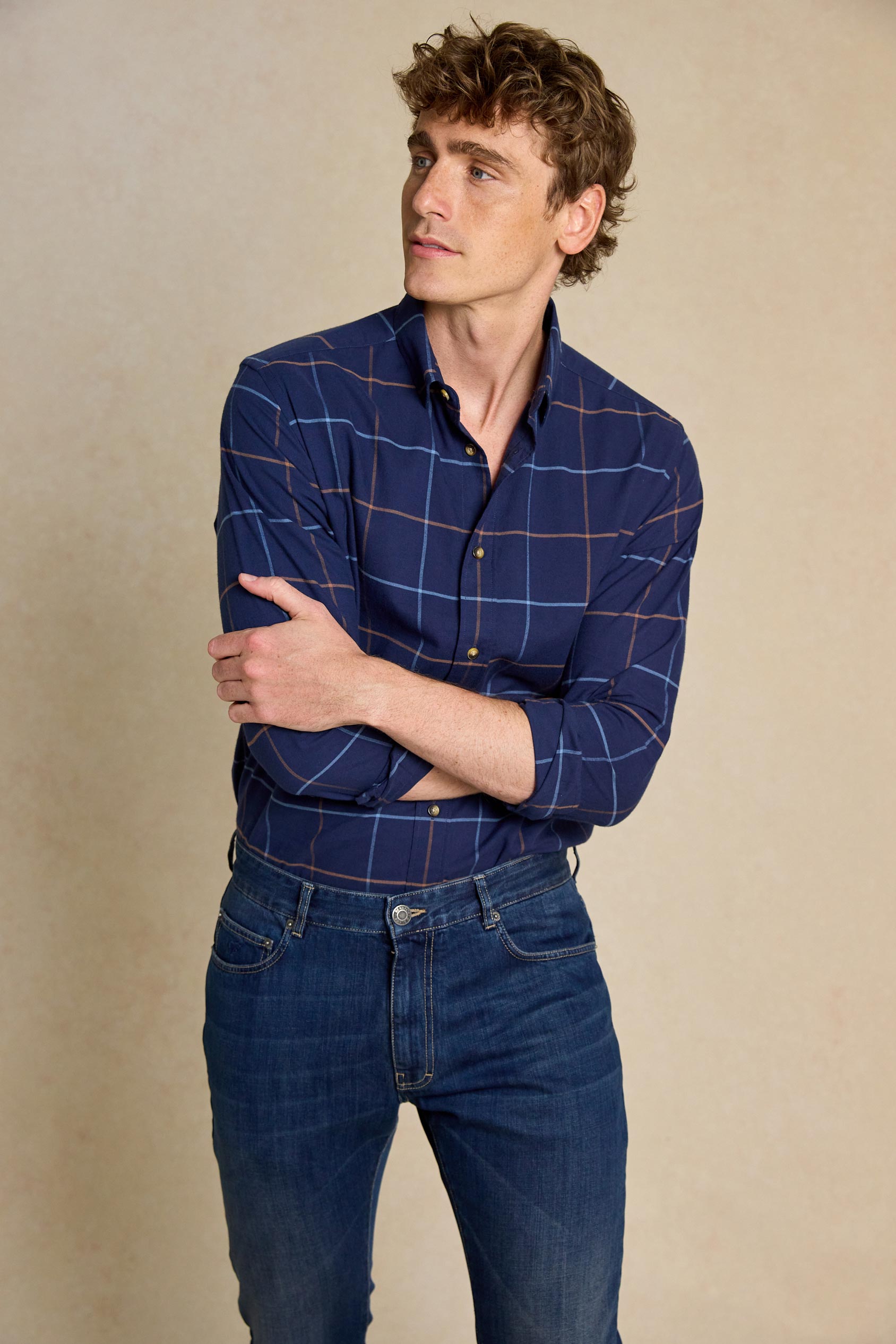 Refine your wardrobe with the Burnham Navy Check Shirt. Made in Portugal and featuring a classic collar, this shirt combines quality with timeless style.