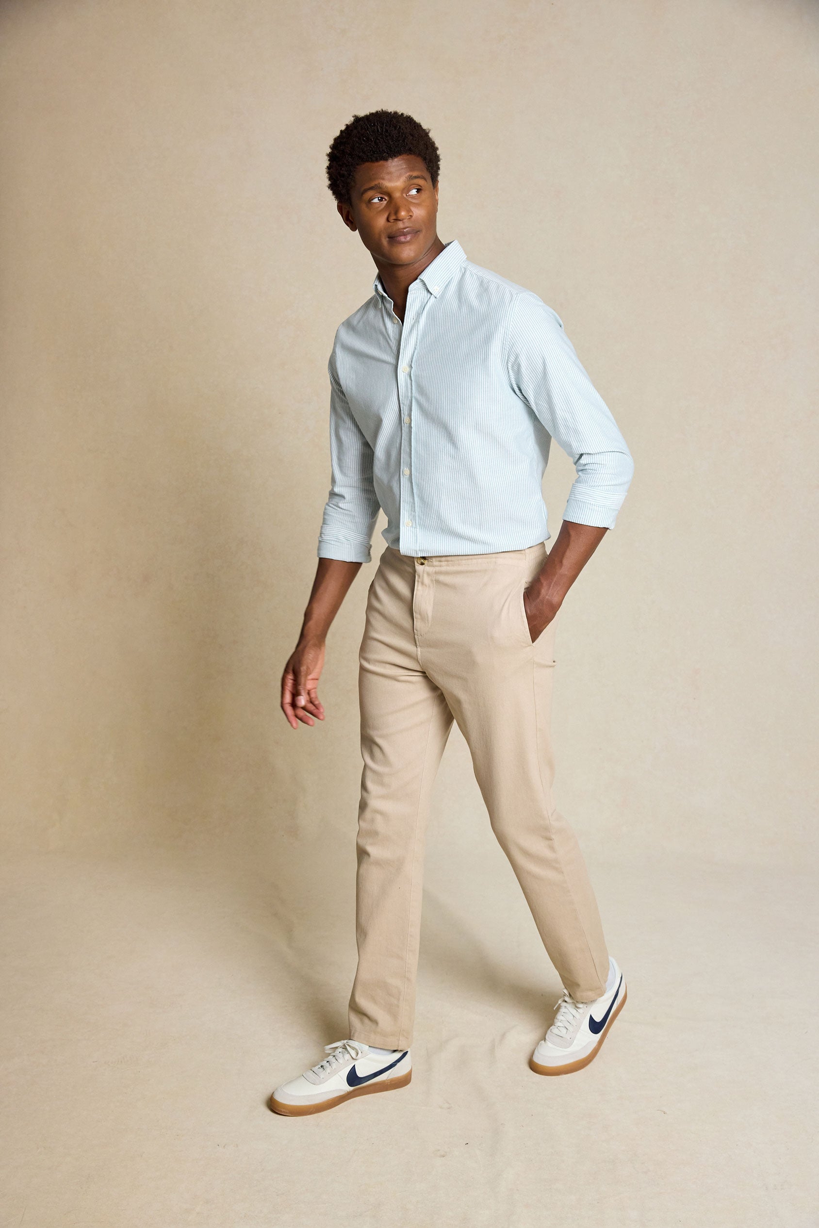 Discover the perfect blend of comfort and style with the Carrick Sand Drawstring Chinos. Featuring an adjustable drawstring waist, these versatile chinos offer a relaxed fit with a modern, tailored look.