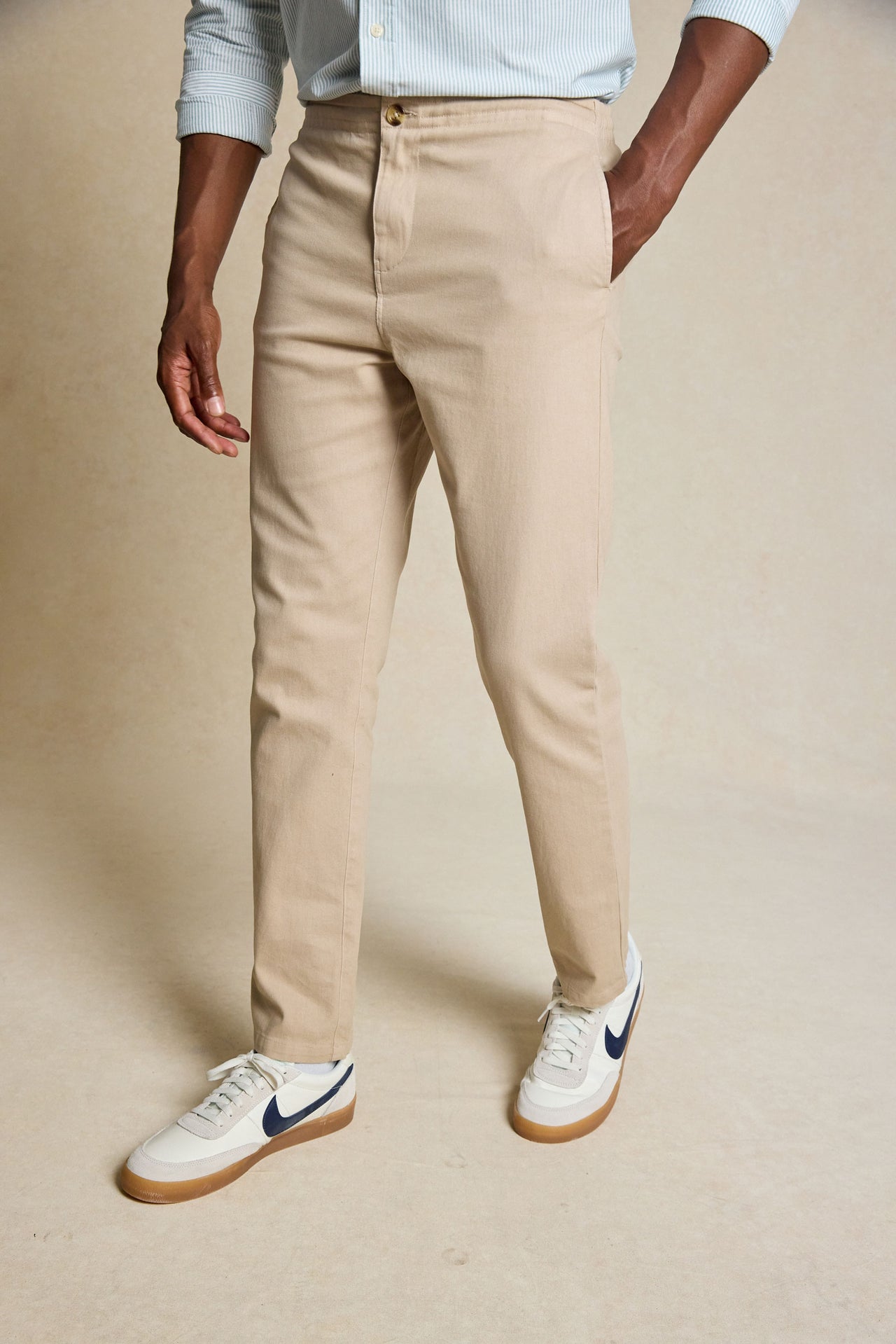 Discover the perfect blend of comfort and style with the Carrick Sand Drawstring Chinos. Featuring an adjustable drawstring waist, these versatile chinos offer a relaxed fit with a modern, tailored look.