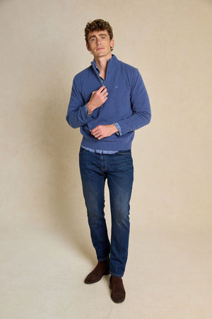 Enhance your wardrobe with the Colesbourne Denim Blue Half Zip Jumper. Made from 100% Italian lambswool, this jumper combines comfort and warmth with timeless style.