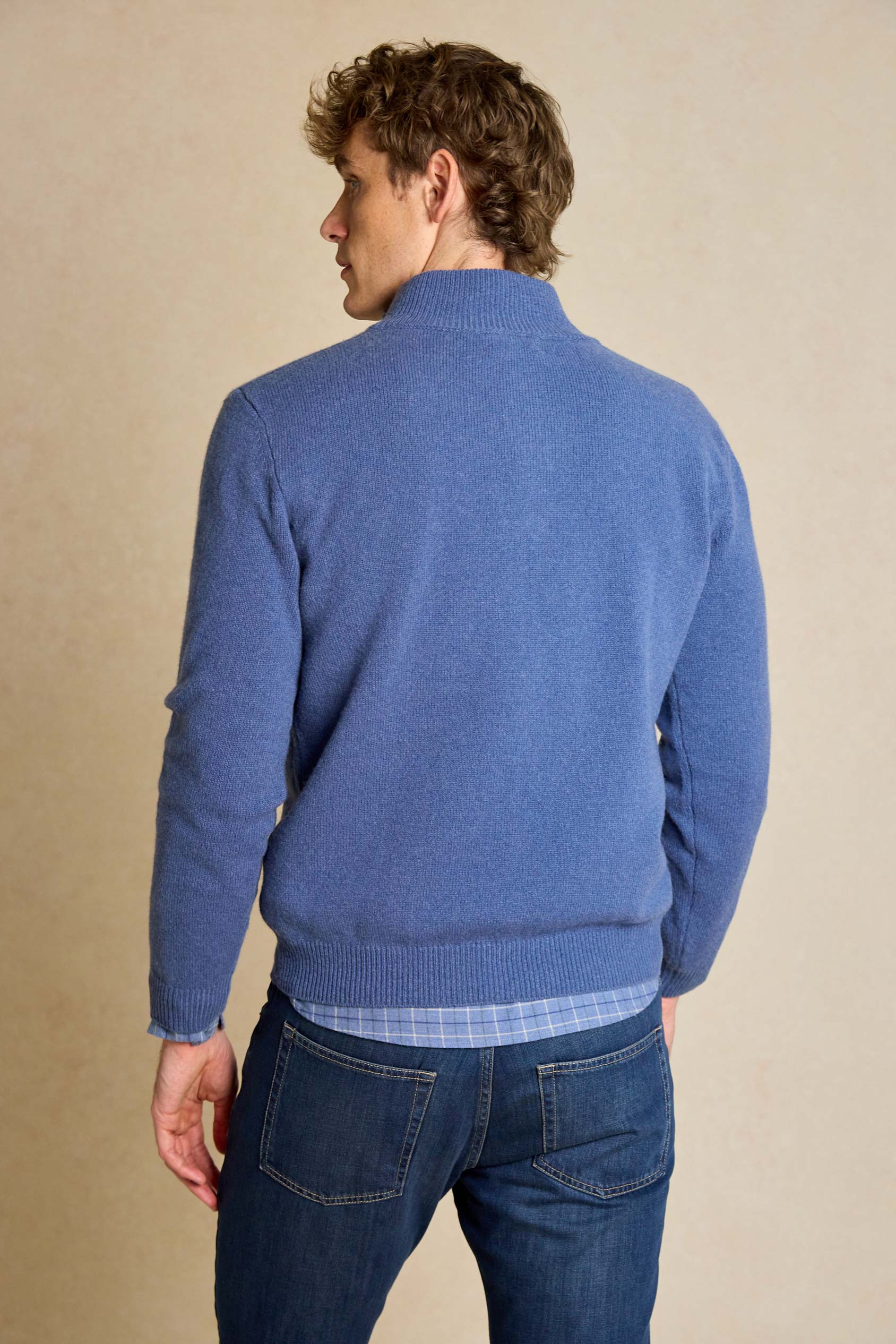 Enhance your wardrobe with the Colesbourne Denim Blue Half Zip Jumper. Made from 100% Italian lambswool, this jumper combines comfort and warmth with timeless style.