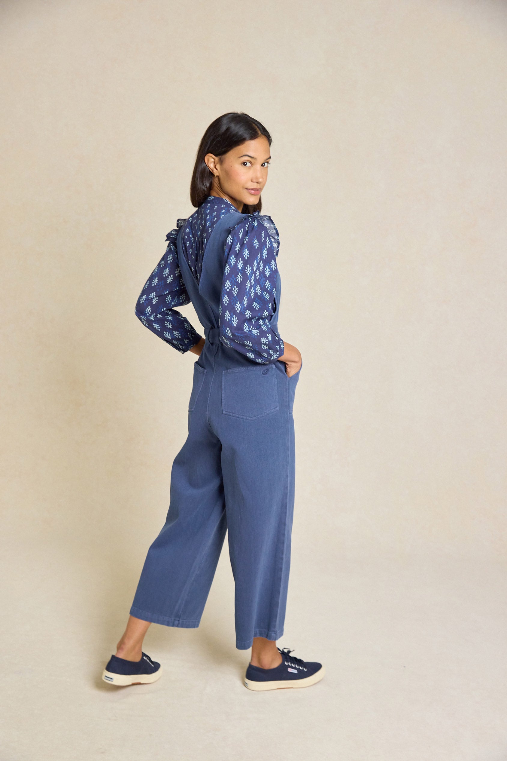 Embrace effortless style with the Darwell Navy Twill Jumpsuit. Featuring a flattering V-neck, tie waist and wide leg design, it's perfect for any occasion