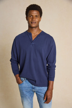 Enhance your casual style with the Fleet Navy Half Button Henley Top. This versatile piece features a classic crew neck half-button design, creating a comfortable yet timeless look.