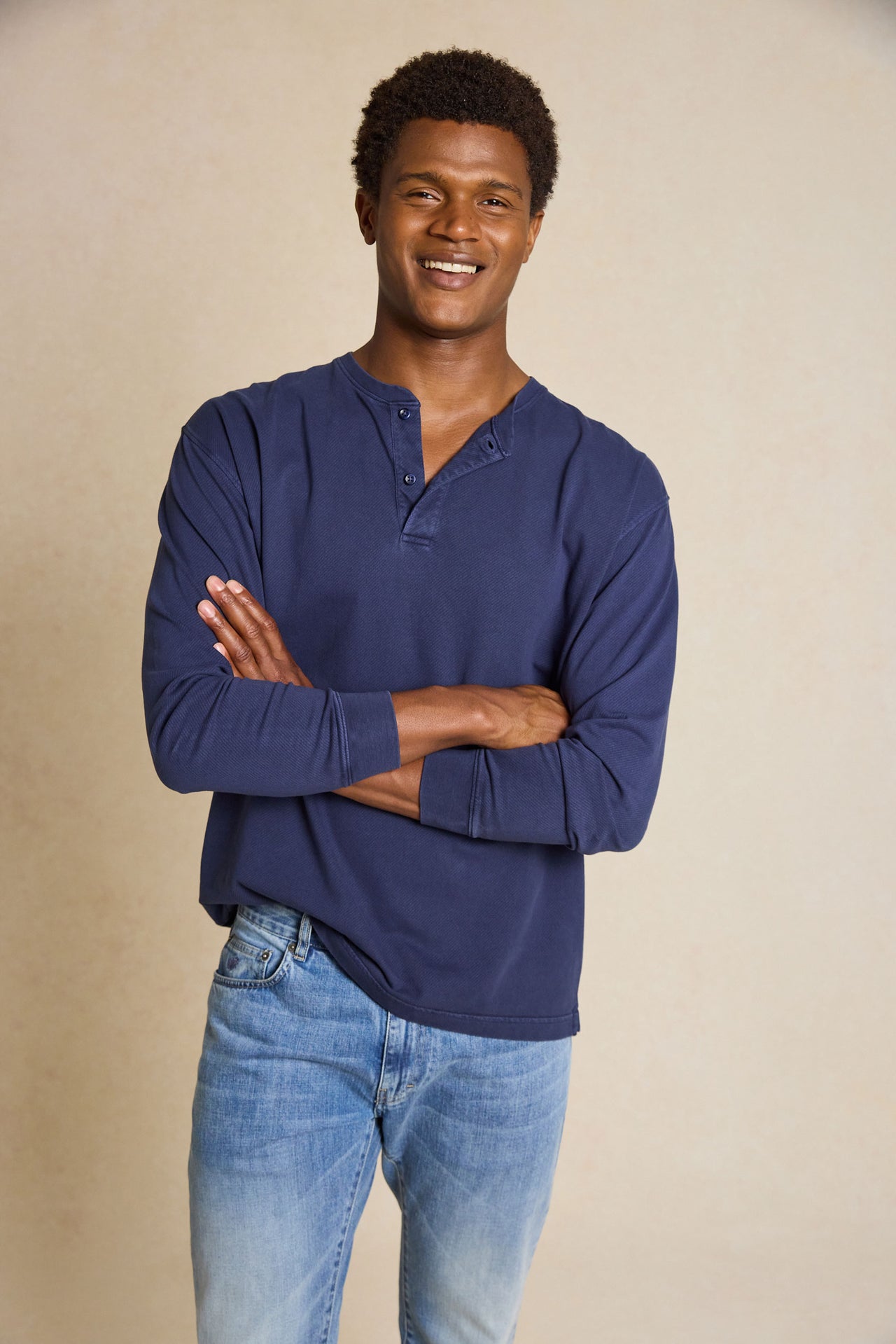 Enhance your casual style with the Fleet Navy Half Button Henley Top. This versatile piece features a classic crew neck half-button design, creating a comfortable yet timeless look.