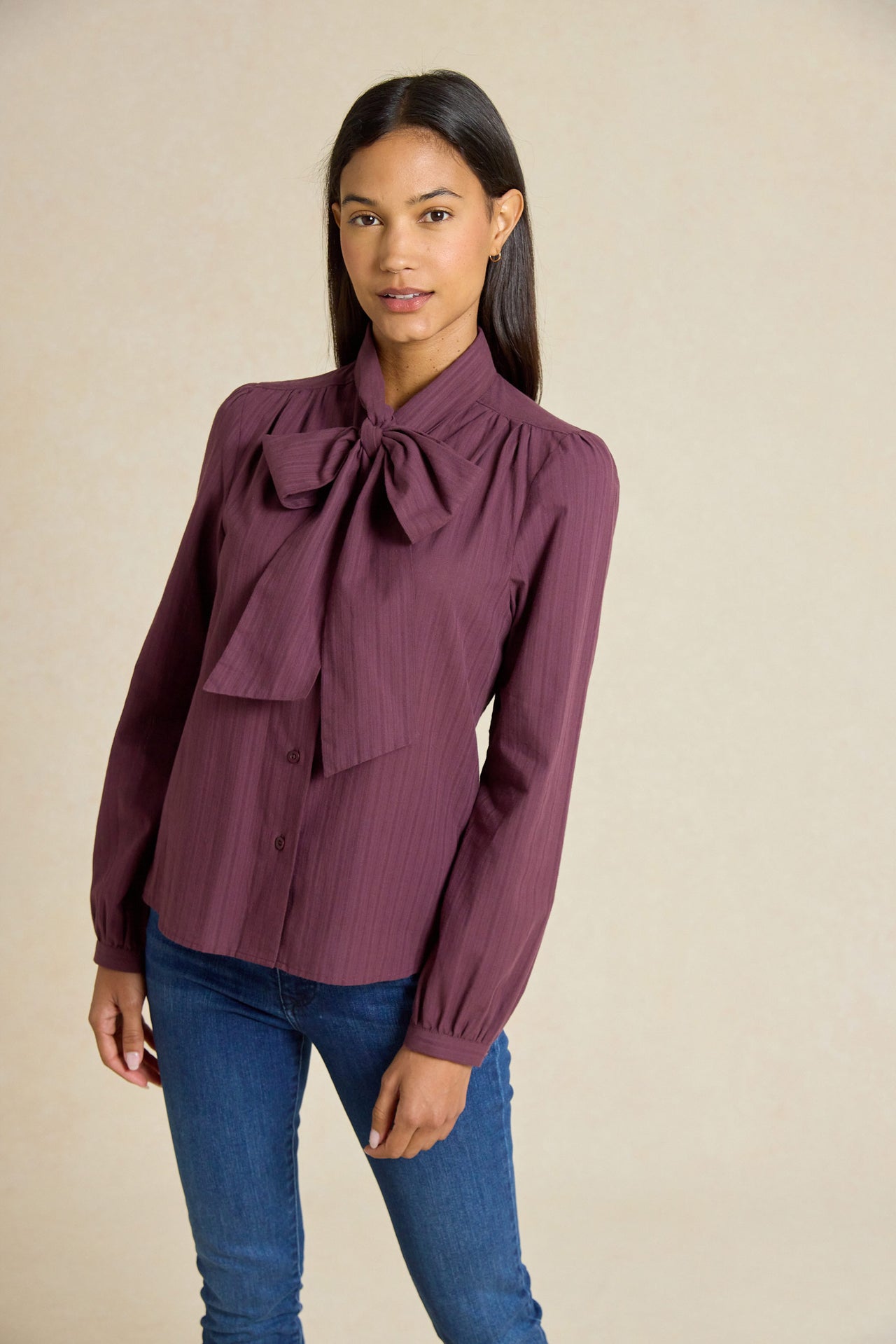 Make a statement with the Foxcote Plum Tie Neck Shirt. Featuring a sophisticated tie neck and rich plum hue, this shirt combines elegance with modern flair.