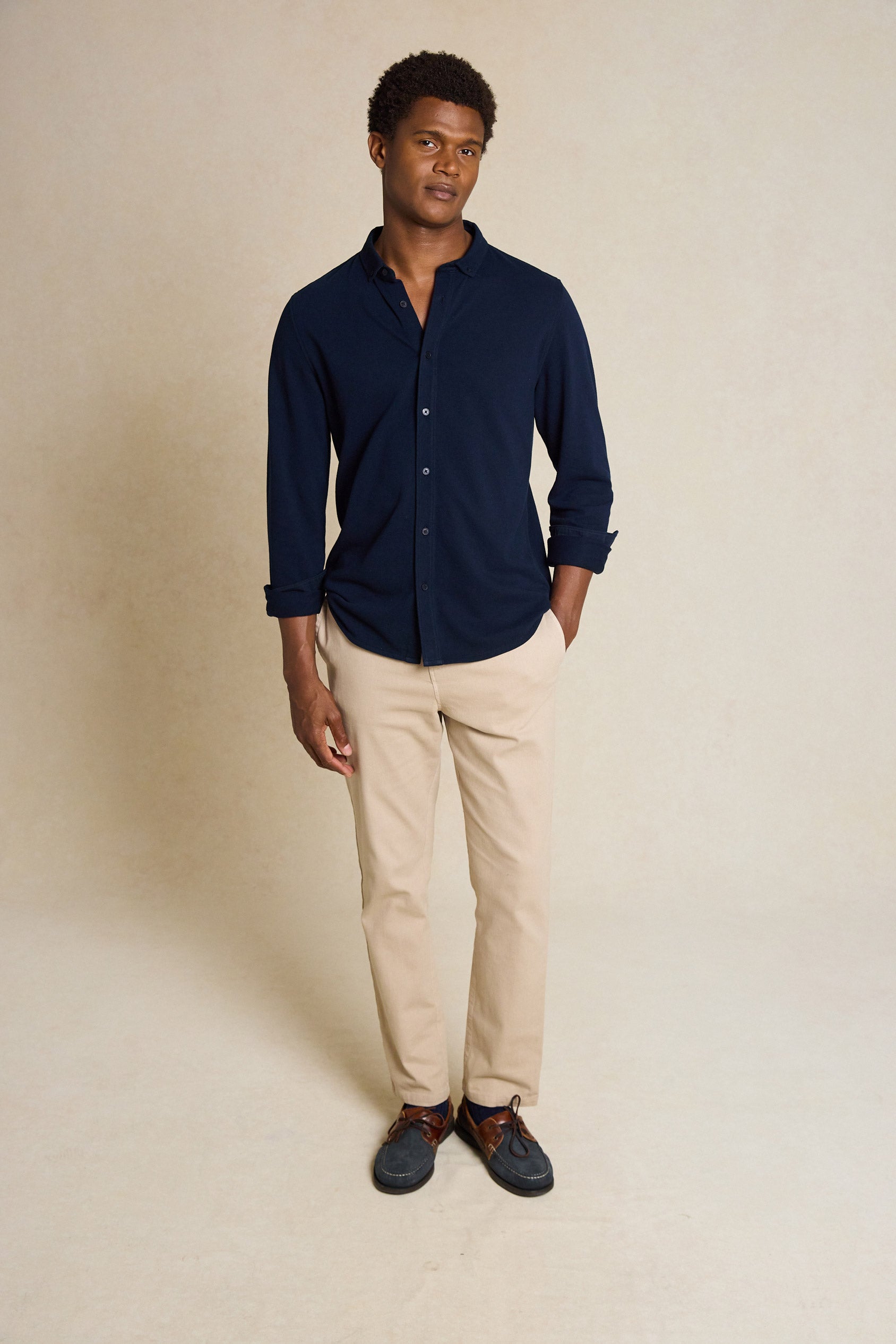 Upgrade your wardrobe with the Galloway Navy Pique Shirt. Made from 100% cotton pique, featuring a button-down collar, this shirt offers both comfort and classic style.