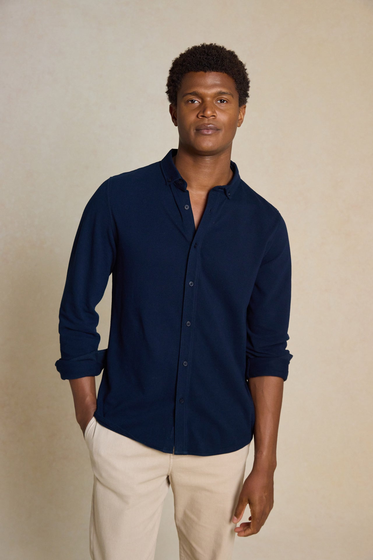 Upgrade your wardrobe with the Galloway Navy Pique Shirt. Made from 100% cotton pique, featuring a button-down collar, this shirt offers both comfort and classic style.