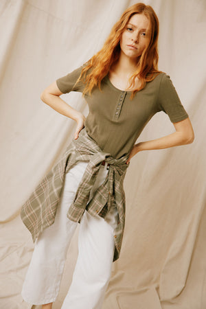 " Discover our Laneshaw Khaki Pointelle tee, a blend of elegance and comfort. Perfect for any occasion, featuring delicate detailing and a flattering fit."