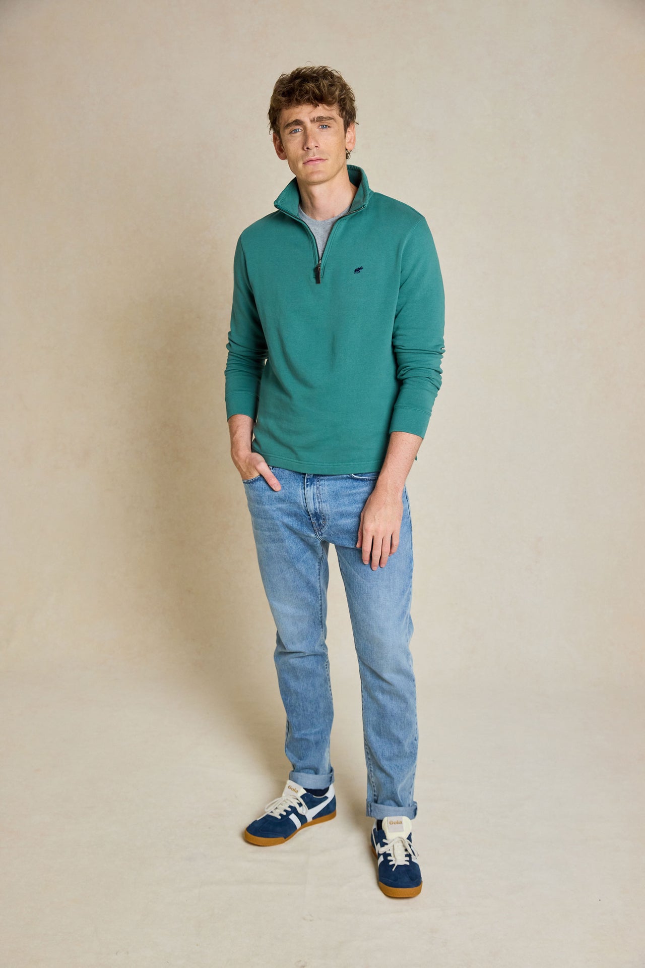 Upgrade your casual wardrobe with the Laurieston Emerald Half Zip Sweat. This versatile piece combines comfort and style, featuring a half zip design, ideal for everyday wear.