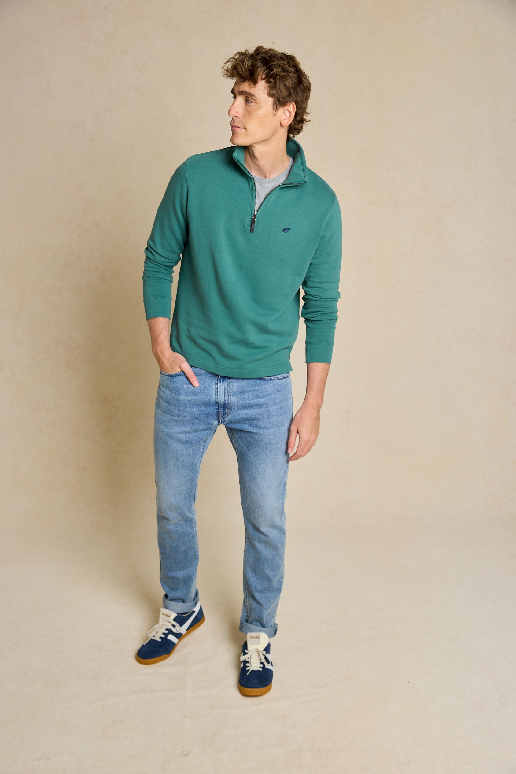 Upgrade your casual wardrobe with the Laurieston Emerald Half Zip Sweat. This versatile piece combines comfort and style, featuring a half zip design, ideal for everyday wear.