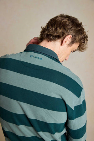 Elevate your casual look with the Mabie Forest Green Stripe Rugby. Made from 100% cotton, this classic men's rugby shirt offers comfort and timeless style for any occasion.