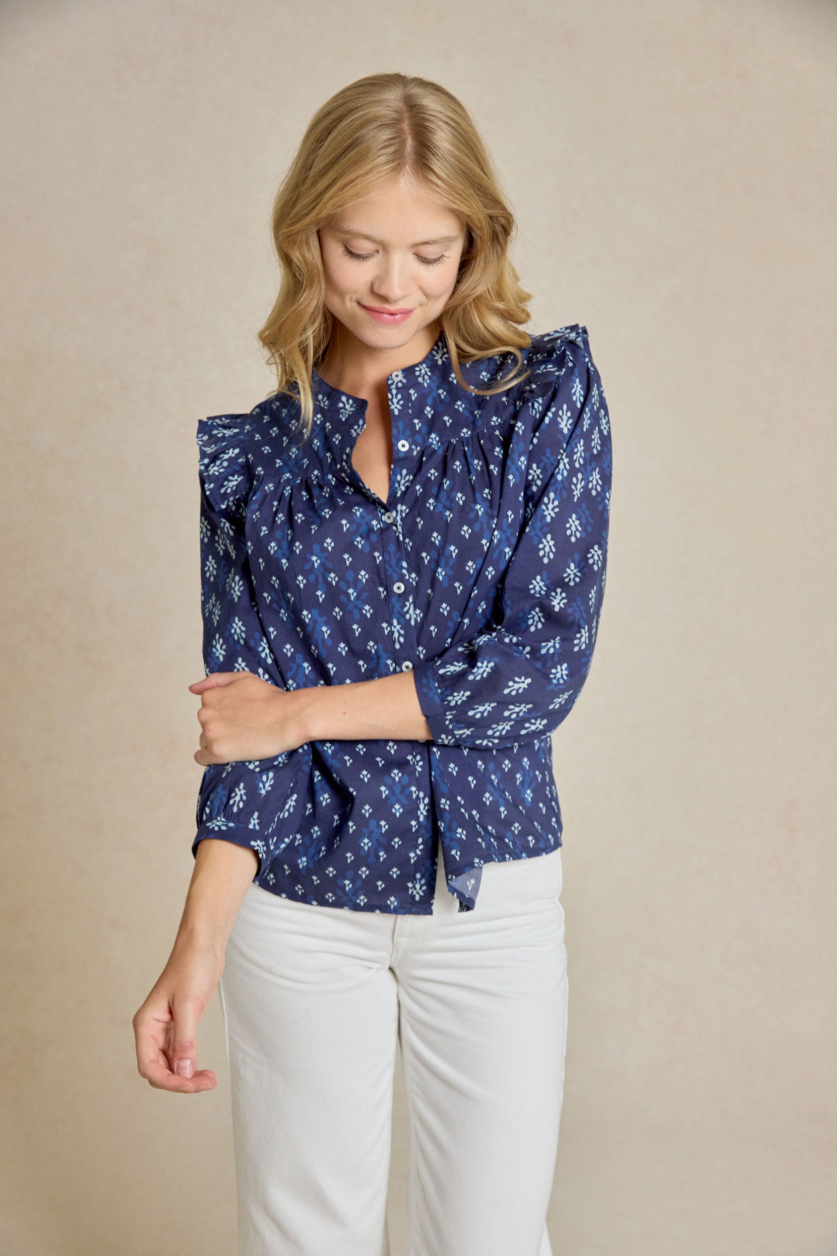 Embrace effortless style with the Molesley Blues Ruffle Printed Top. Indigo-dyed with a bespoke print. This shirt combines a classic Nehru collar with delicate ruffle details.