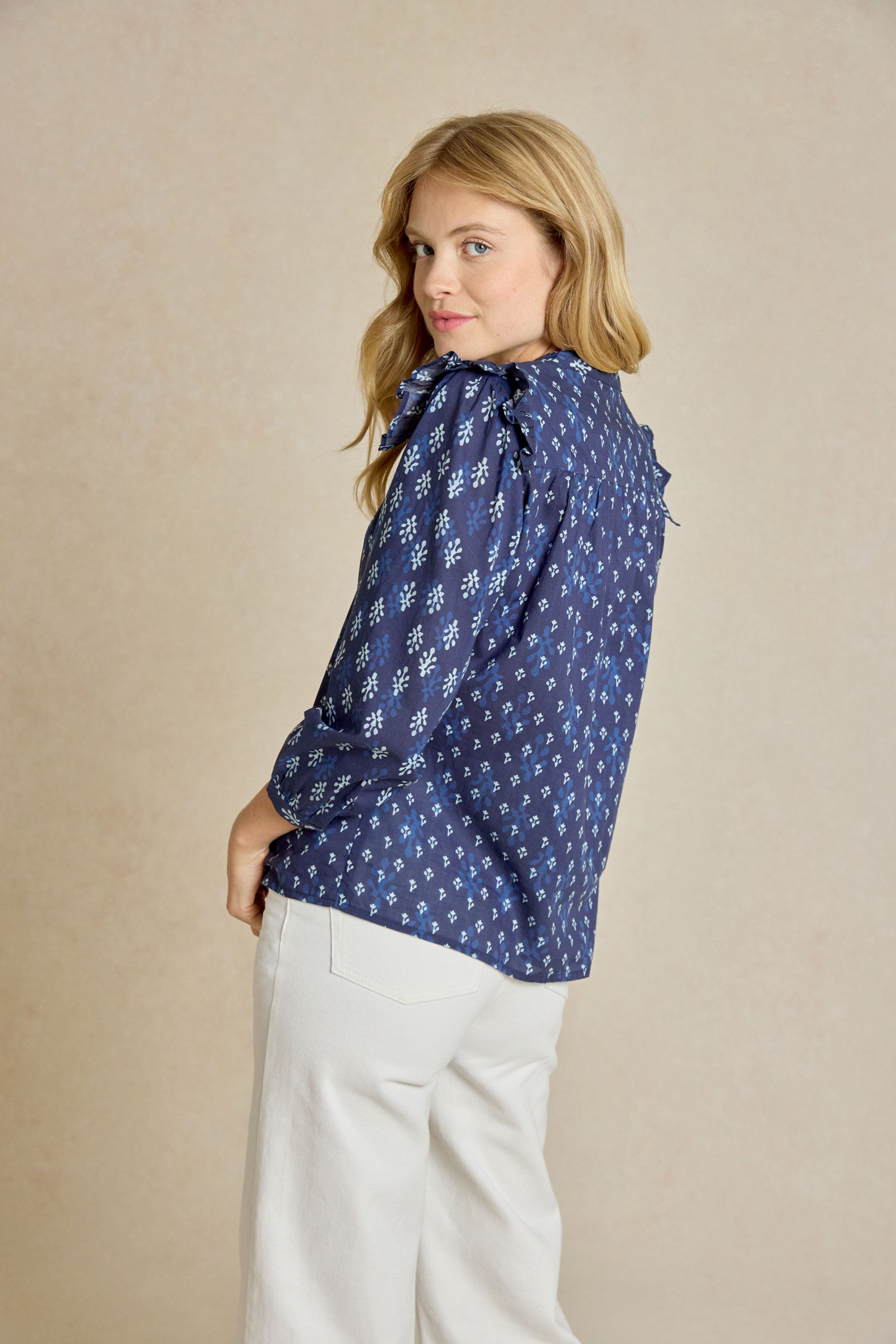 Embrace effortless style with the Molesley Blues Ruffle Printed Top. Indigo-dyed with a bespoke print. This shirt combines a classic Nehru collar with delicate ruffle details.