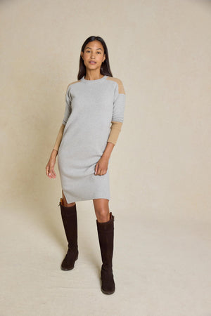 Step out in style with the Naden Grey Knitted Dress. This dress features a classic crew neck and striking color block details, perfect for an effortless look.