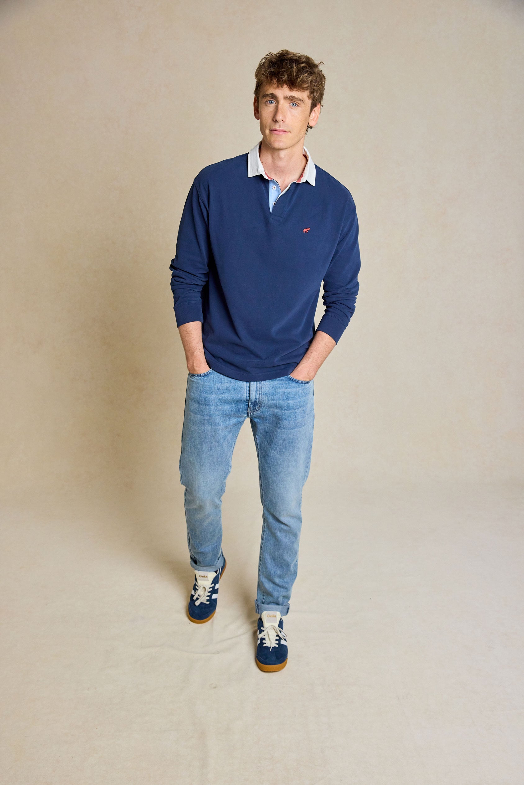 Upgrade your casual wardrobe with the Penninghame Navy Rugby. Featuring a soft peached finish and chambray details, this rugby shirt combines comfort with refined style.