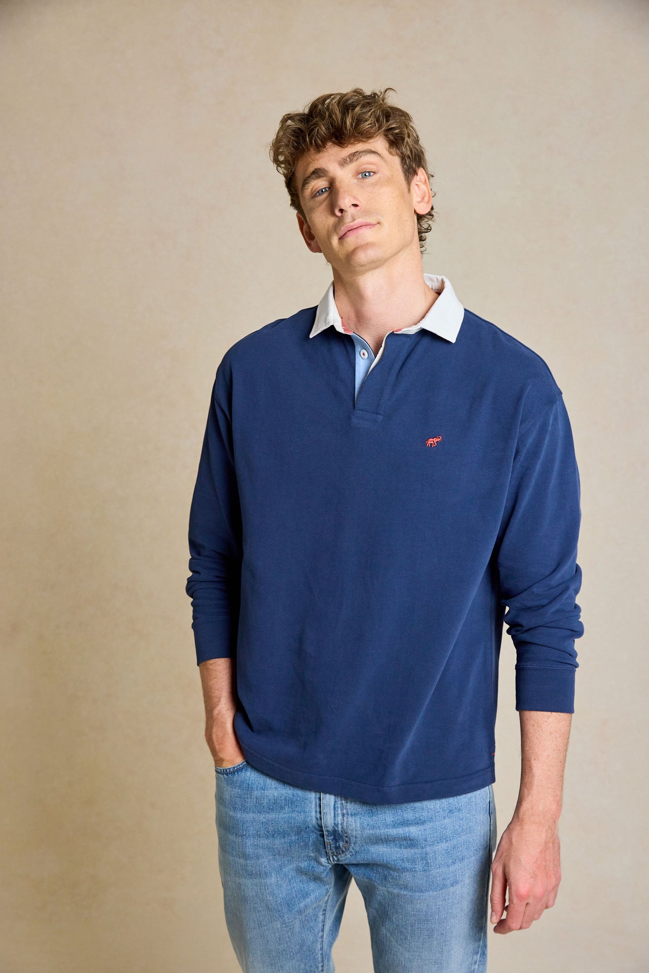 Upgrade your casual wardrobe with the Penninghame Navy Rugby. Featuring a soft peached finish and chambray details, this rugby shirt combines comfort with refined style.