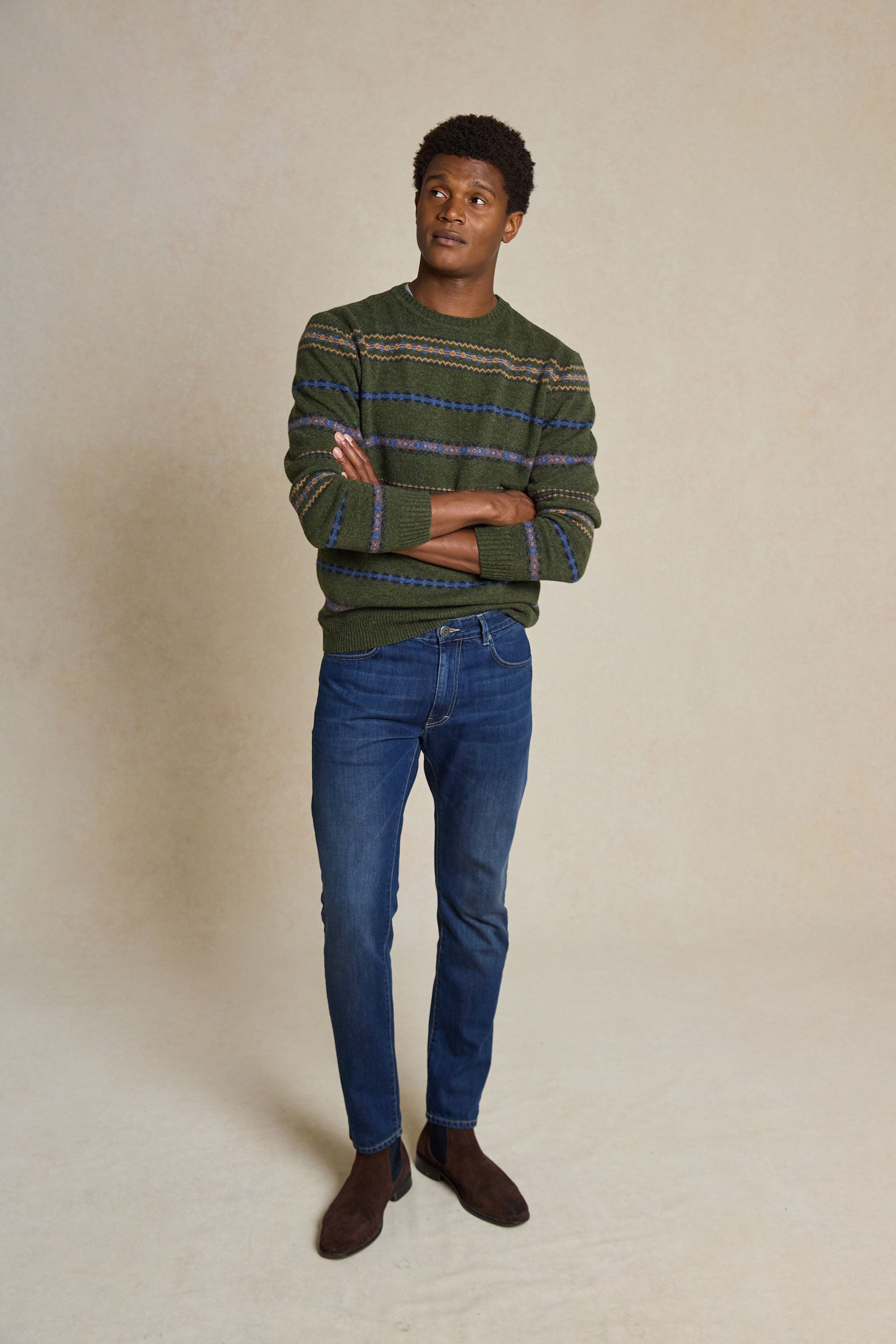 Upgrade your wardrobe with the Wareham Fair Crew Neck Jumper. Featuring a classic Fair Isle pattern, this cozy jumper blends timeless style with modern comfort.