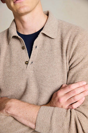 Elevate your winter style with the Winterfold Oat Polo Jumper. Crafted from luxurious Italian wool, this refined piece is hand wash only, ensuring long-lasting quality and comfort.