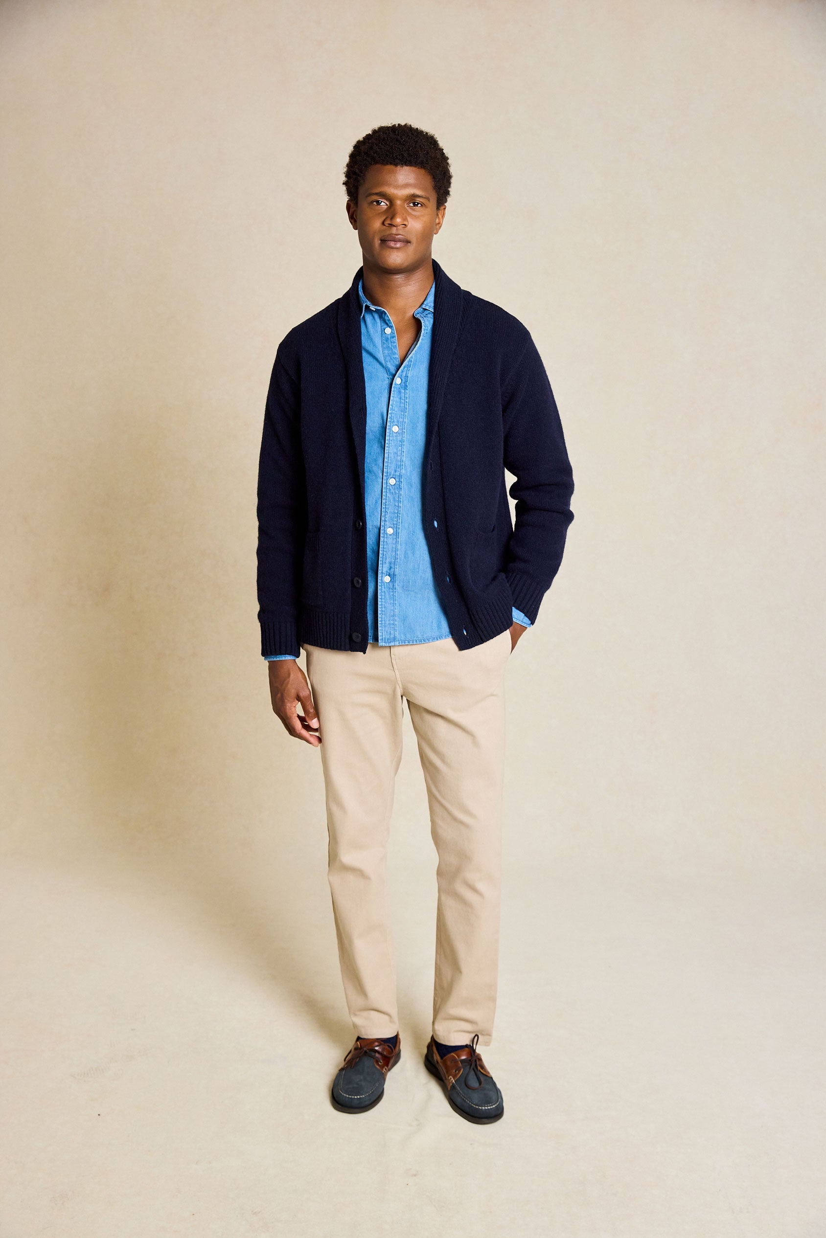 Refine your wardrobe with the Worth Navy Shawl Collar Cardigan. This stylish piece features a cozy shawl collar and is hand wash only, ensuring long-lasting quality and style.