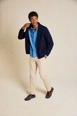 Refine your wardrobe with the Worth Navy Shawl Collar Cardigan. This stylish piece features a cozy shawl collar and is hand wash only, ensuring long-lasting quality and style.