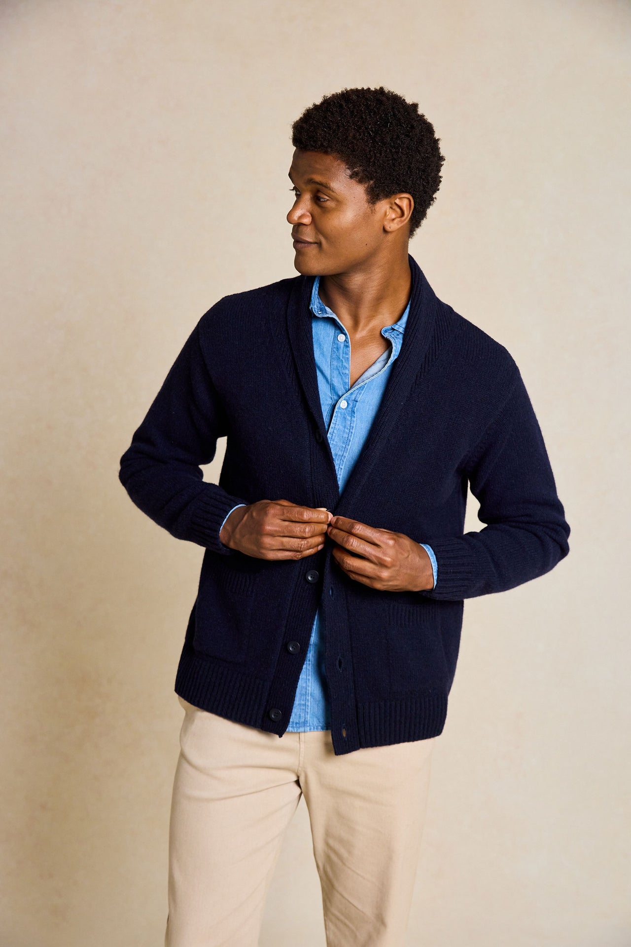 Refine your wardrobe with the Worth Navy Shawl Collar Cardigan. This stylish piece features a cozy shawl collar and is hand wash only, ensuring long-lasting quality and style.