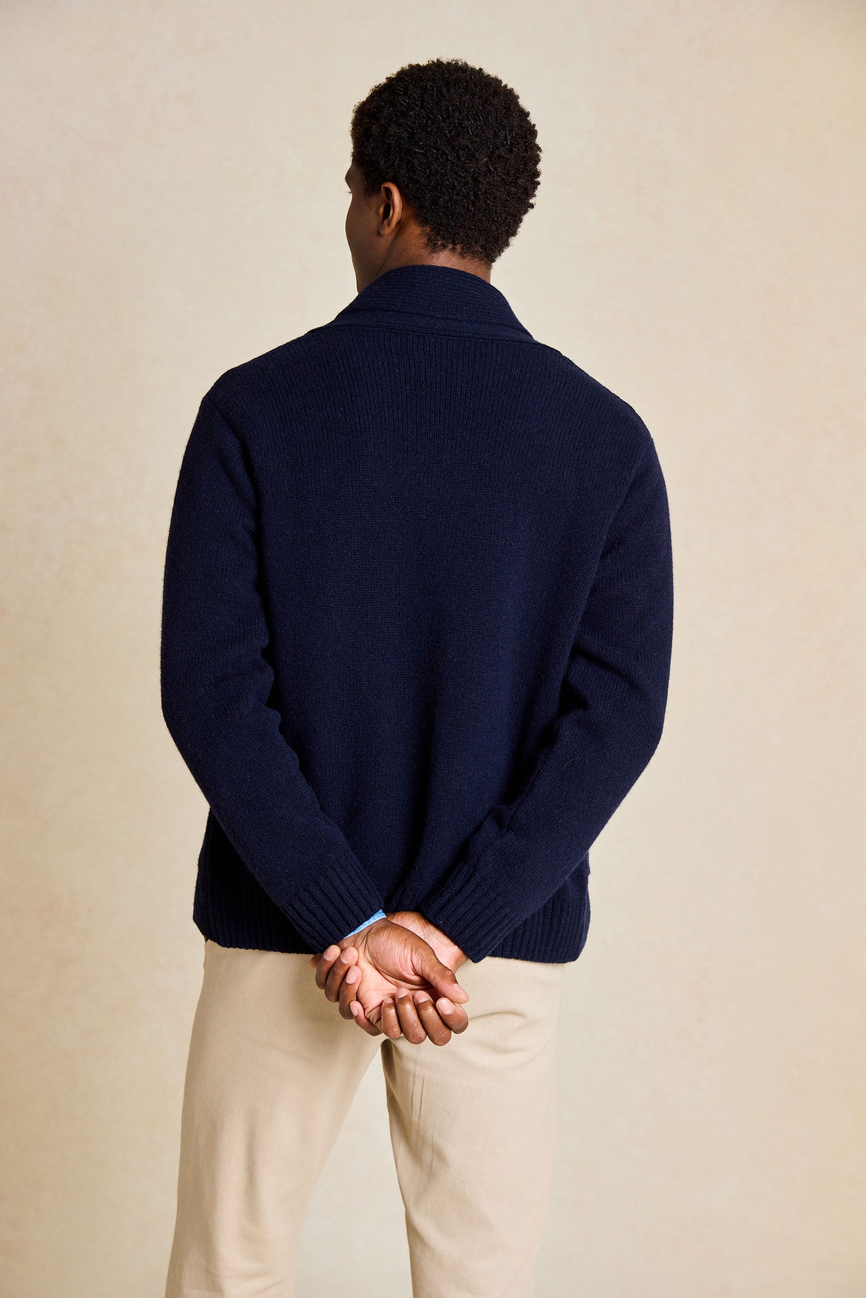 Refine your wardrobe with the Worth Navy Shawl Collar Cardigan. This stylish piece features a cozy shawl collar and is hand wash only, ensuring long-lasting quality and style.